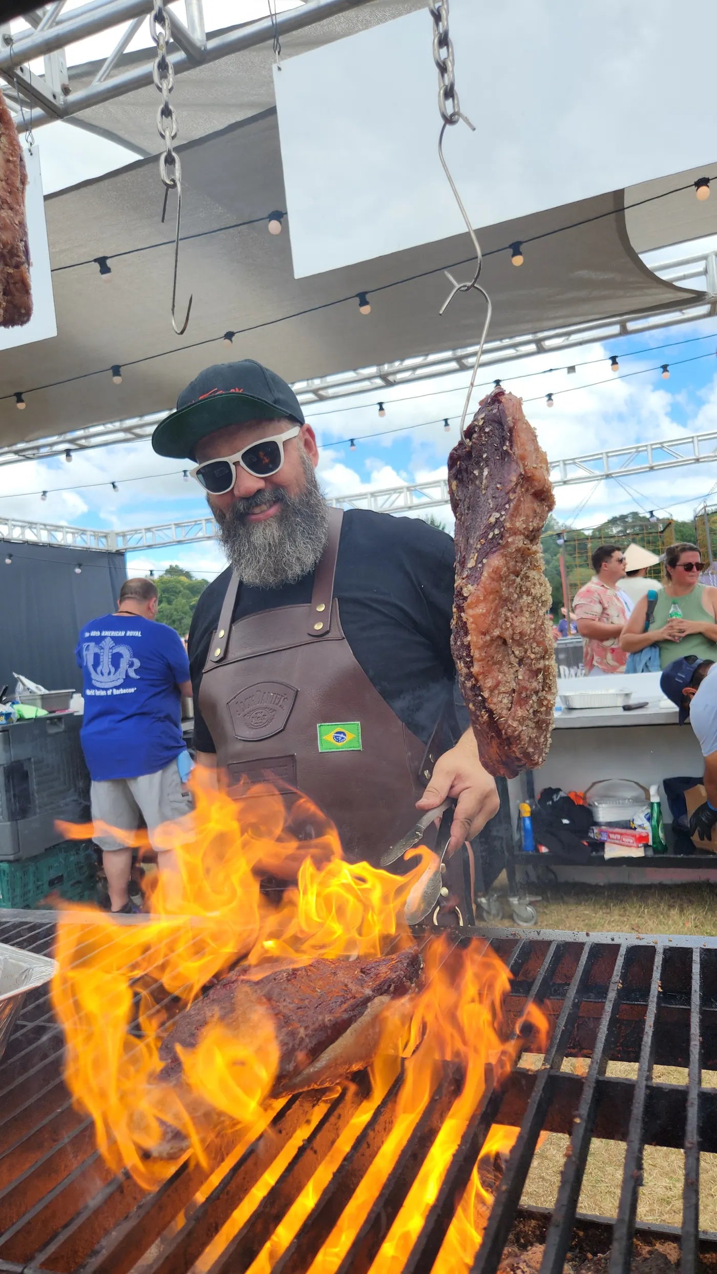 Adriano cooking beef ribs over a live fire