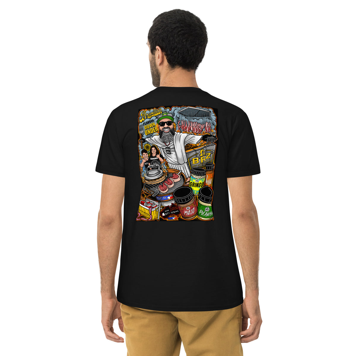 Man wearing the black tee seen from behind, the full illustration across his back