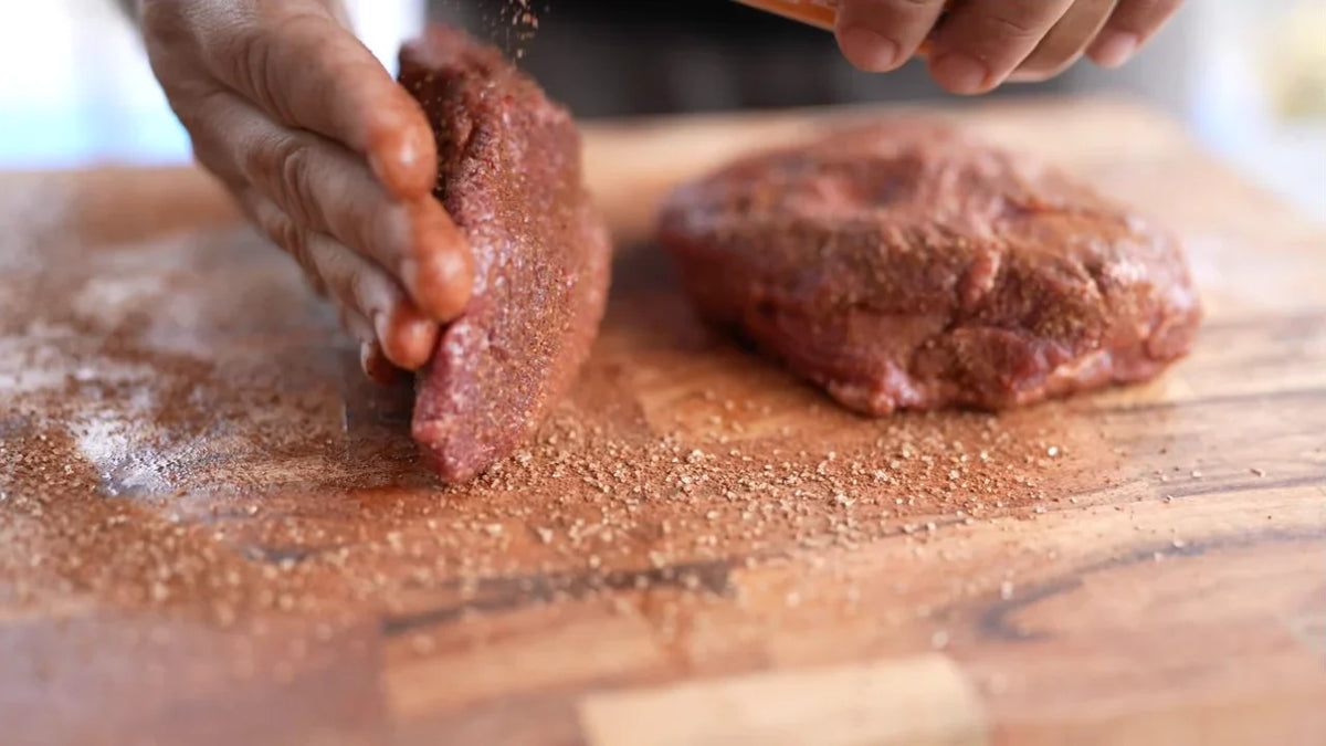 The seasoning. Adriano applying Mexicana seasoning to beef cheeks