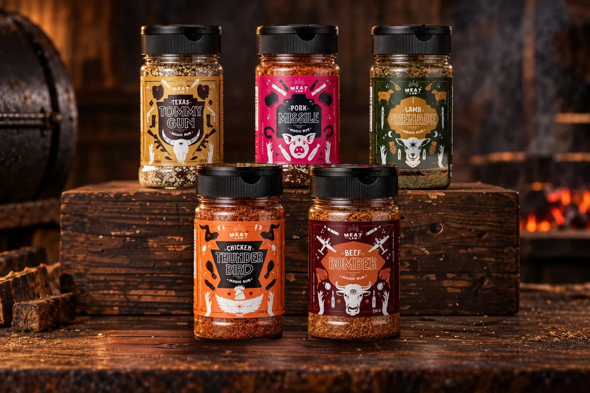 Five Meat Lab rub jars arranged on a timber barbecue workbench